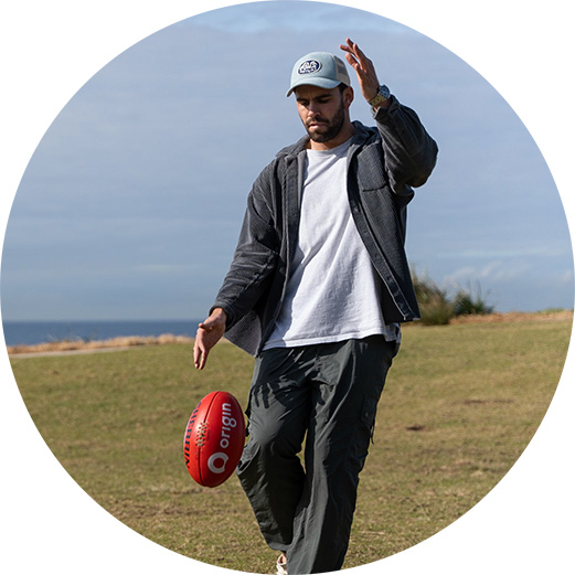 Man kicking football